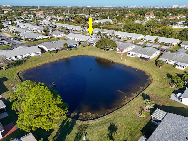 birds eye view of property with a water view and a residential view