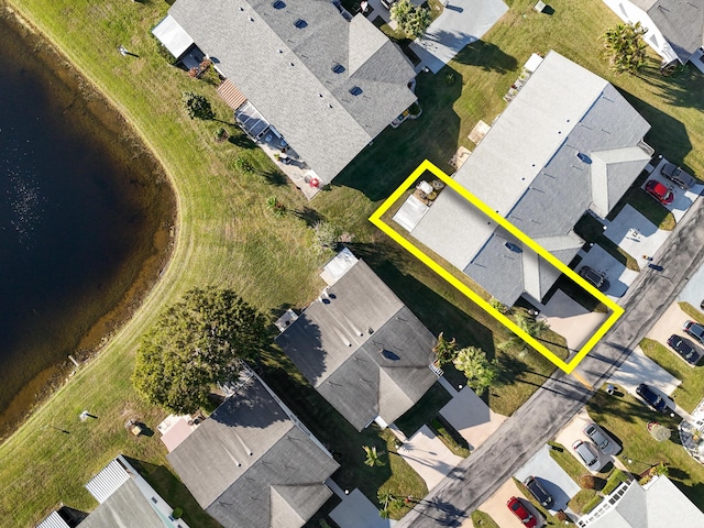 bird's eye view with a residential view and a water view