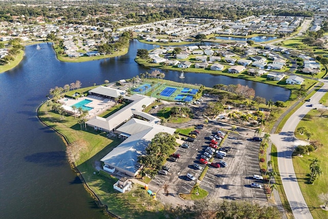 bird's eye view featuring a water view and a residential view