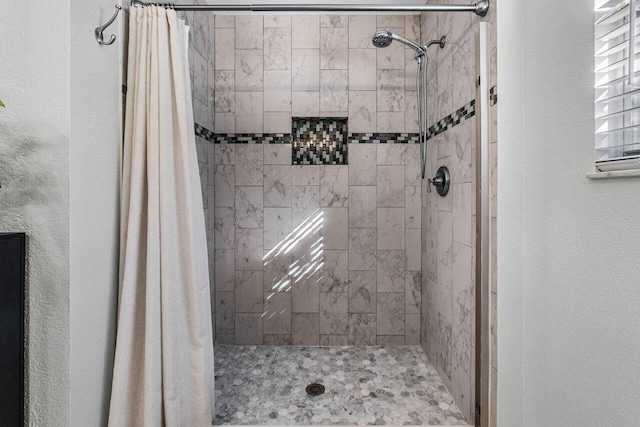 bathroom with a shower with shower curtain