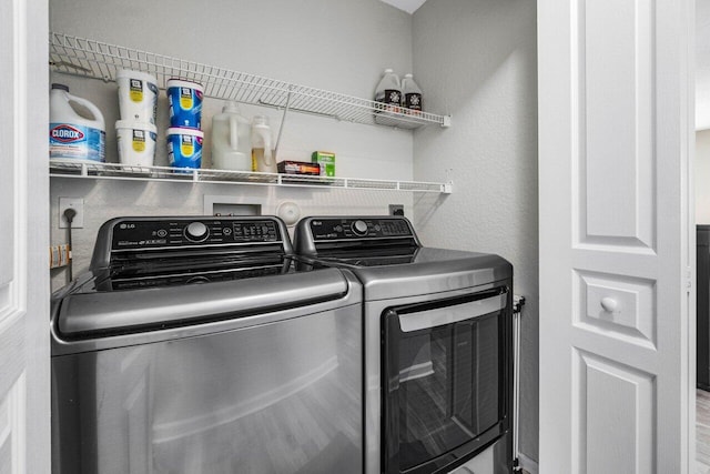 laundry room with washing machine and dryer