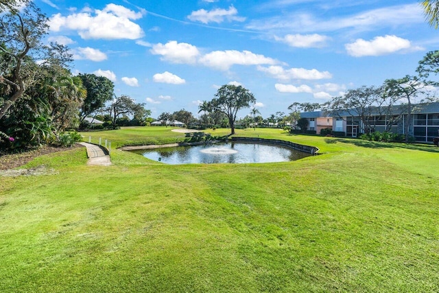 exterior space with a lawn and a water view