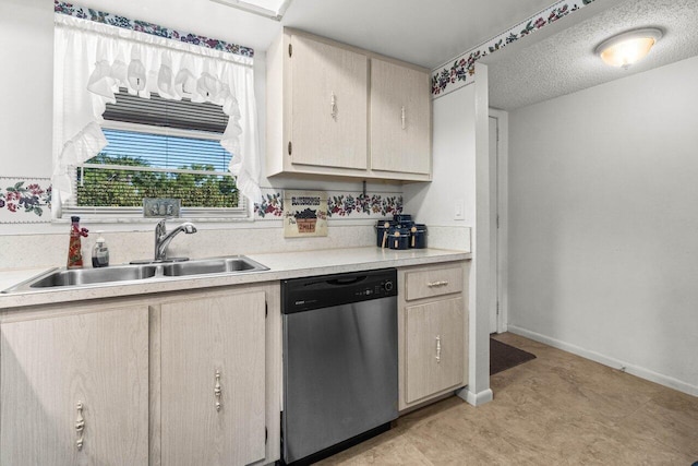 kitchen with dishwasher, sink, and light brown cabinets