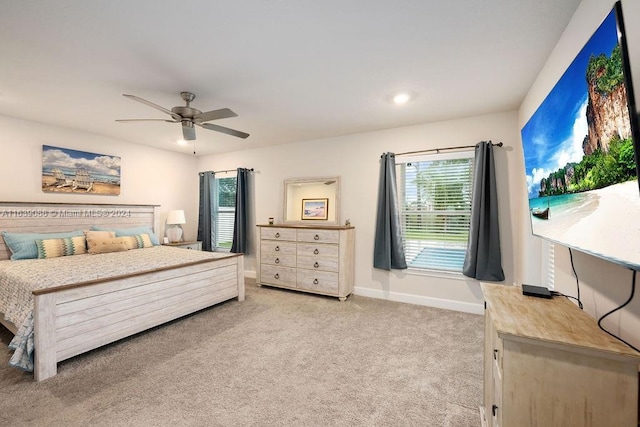 bedroom with light colored carpet and ceiling fan