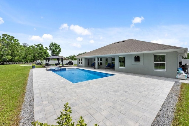 view of pool featuring a yard, a gazebo, and a patio area