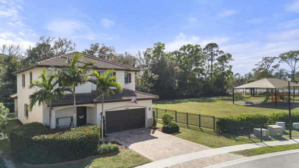 view of front of house with a garage and a front lawn