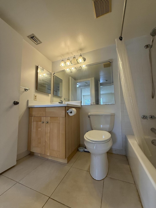 full bathroom with tile patterned floors, toilet, vanity, and shower / bath combo