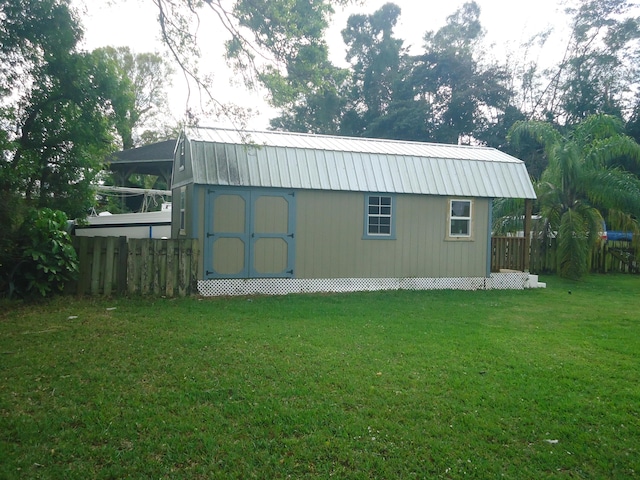 view of shed with fence