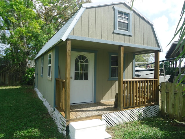 view of outbuilding with fence