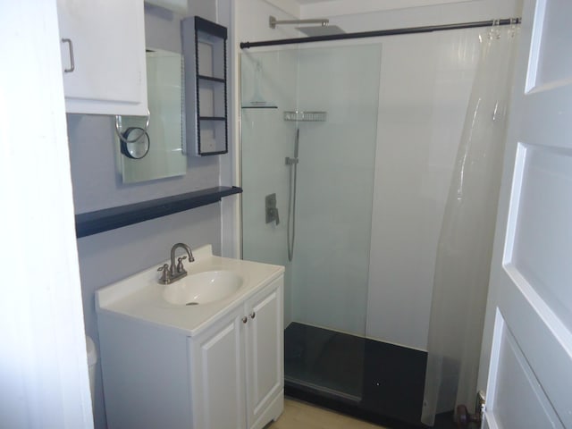 full bathroom with toilet, vanity, and a shower with shower curtain