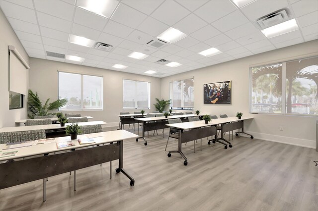 office area featuring light wood-type flooring and visible vents