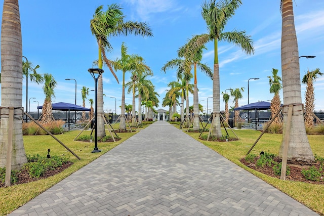 surrounding community with a yard and a gazebo