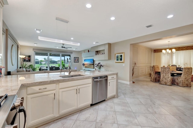 kitchen featuring visible vents, open floor plan, a sink, range, and dishwasher