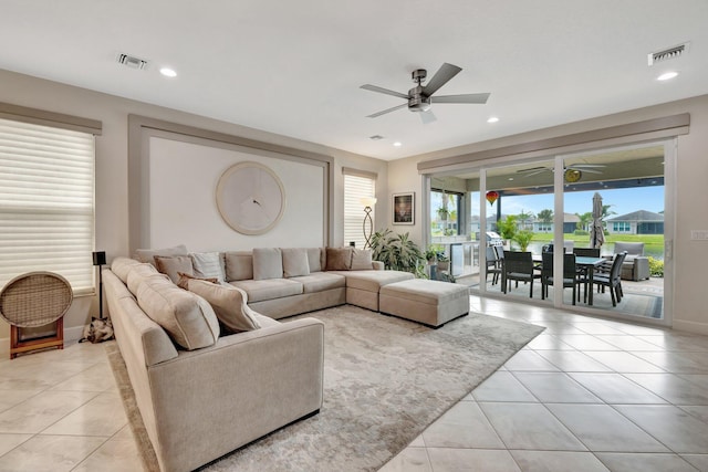 living room featuring recessed lighting, visible vents, ceiling fan, and light tile patterned floors