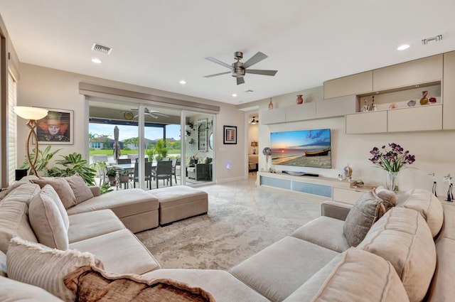 living area featuring visible vents, a ceiling fan, and recessed lighting