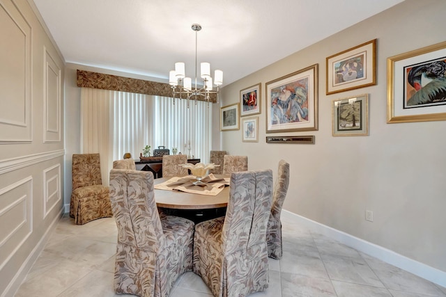 dining area with light tile patterned floors, baseboards, and a chandelier