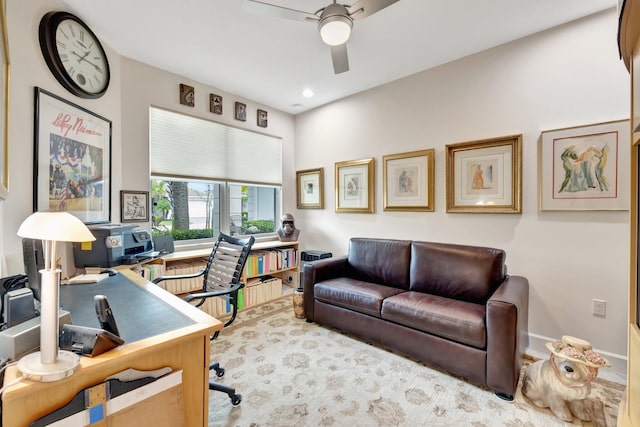 office with ceiling fan and baseboards