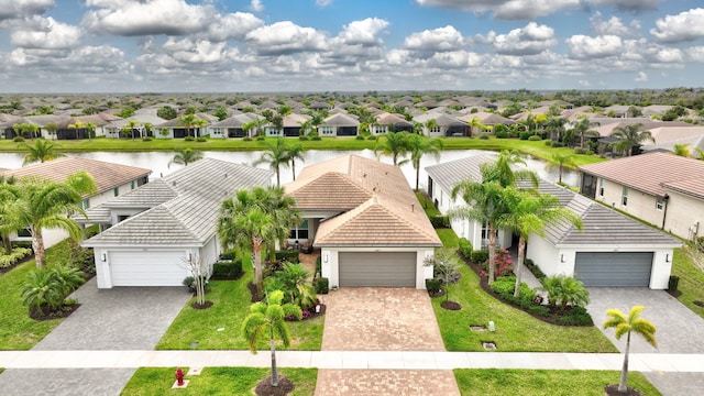 birds eye view of property with a residential view