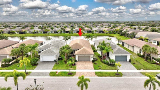 aerial view with a water view and a residential view