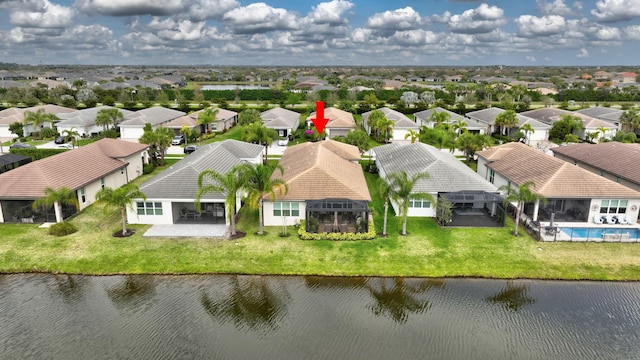 aerial view featuring a water view and a residential view