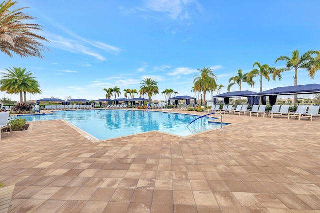 community pool featuring a gazebo and a patio