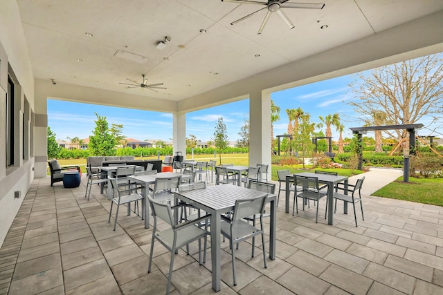 view of patio / terrace with ceiling fan and outdoor dining area