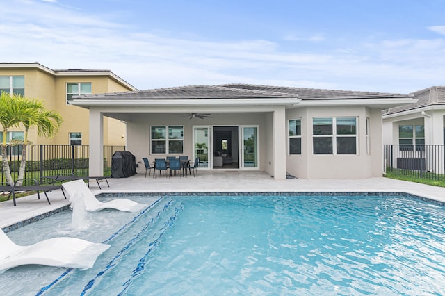 view of pool featuring ceiling fan and a patio