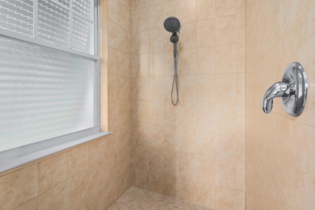 bathroom featuring tiled shower