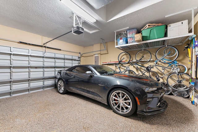 garage with a garage door opener and electric panel