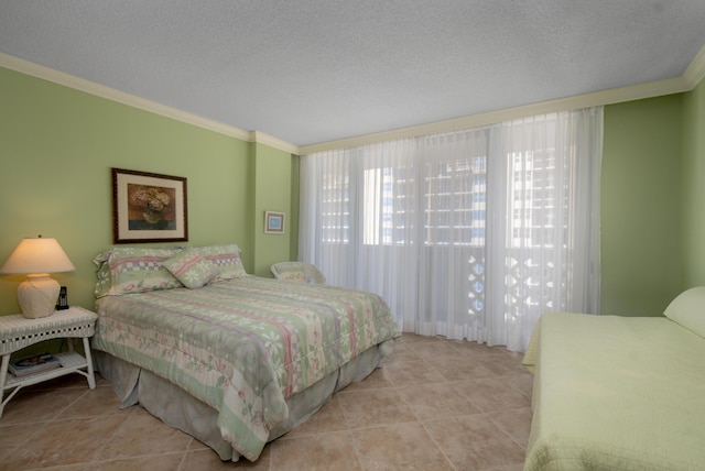 bedroom featuring a textured ceiling, light tile patterned flooring, and crown molding