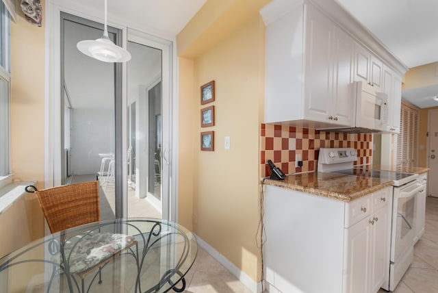 kitchen with decorative light fixtures, tasteful backsplash, white cabinets, light stone countertops, and white appliances