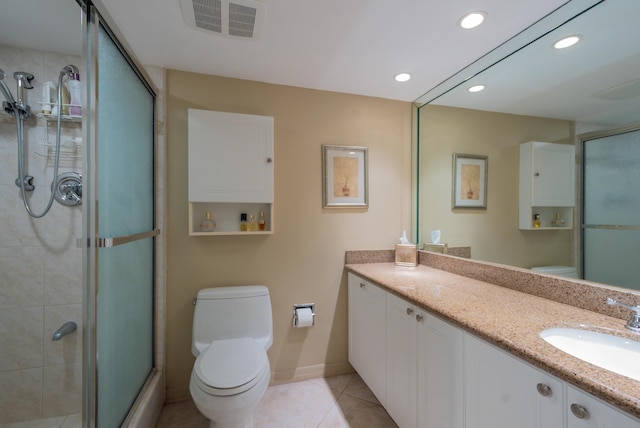 full bath featuring tile patterned flooring, toilet, vanity, visible vents, and a shower stall