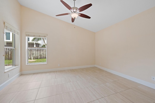 unfurnished room with ceiling fan, vaulted ceiling, and light tile patterned floors