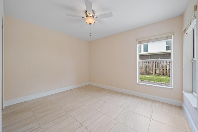 tiled empty room with ceiling fan