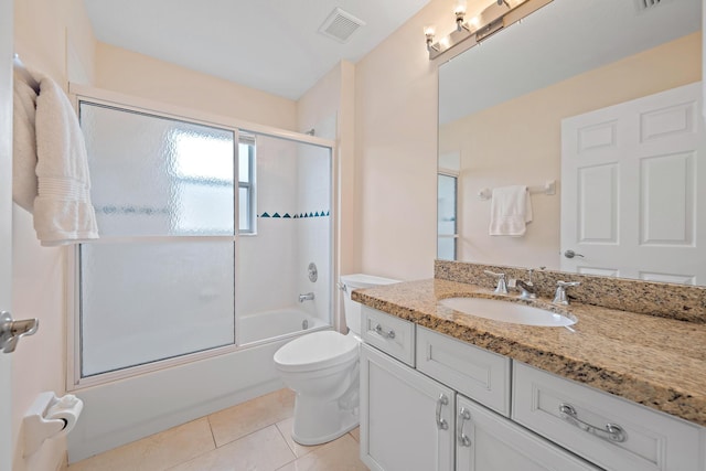 full bathroom with enclosed tub / shower combo, tile patterned floors, toilet, and vanity