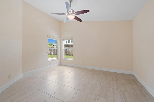 empty room with light tile patterned flooring and ceiling fan