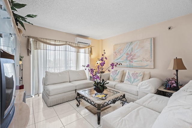 living room featuring light tile patterned flooring, a textured ceiling, and an AC wall unit