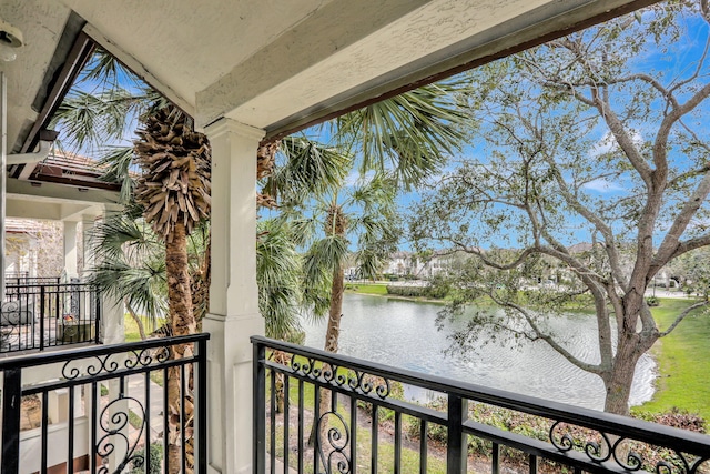 balcony featuring a water view