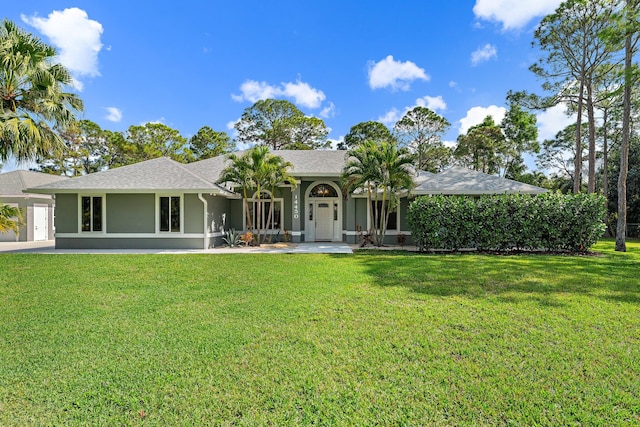 14450 69th Dr N, Palm Beach Gardens, FL 33418 - ranch-style house featuring stucco siding, a shingled roof, and a front lawn
