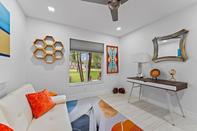 sitting room featuring ceiling fan