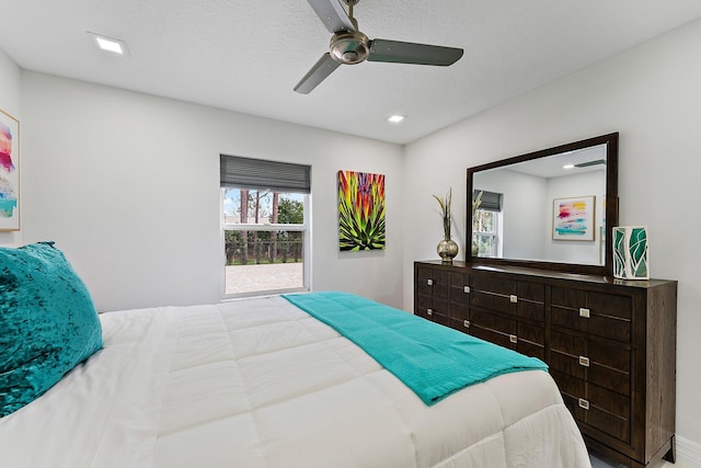 bedroom featuring a textured ceiling and ceiling fan