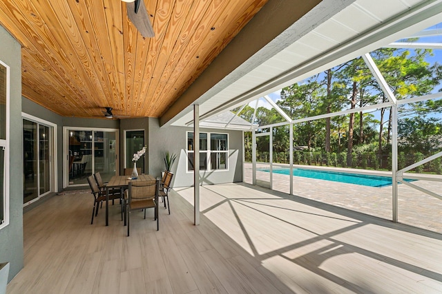 unfurnished sunroom with wood ceiling