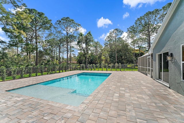 view of swimming pool featuring a patio area