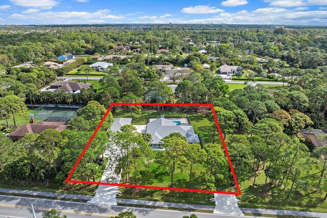 14450 69th Dr N, Palm Beach Gardens, FL 33418 - view of front of home with a front lawn and a garage