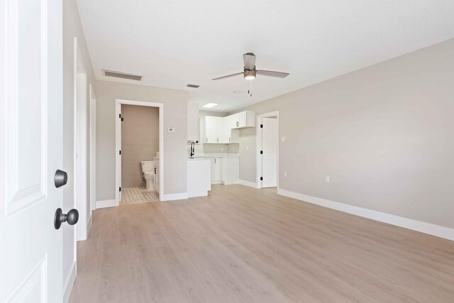 interior space with ceiling fan and light wood-type flooring