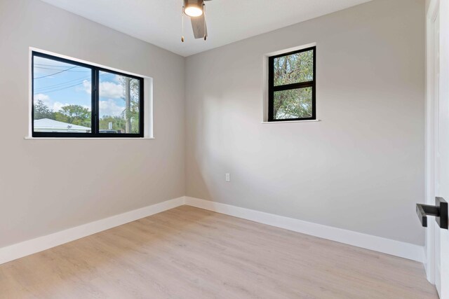 unfurnished room with a healthy amount of sunlight and light wood-type flooring