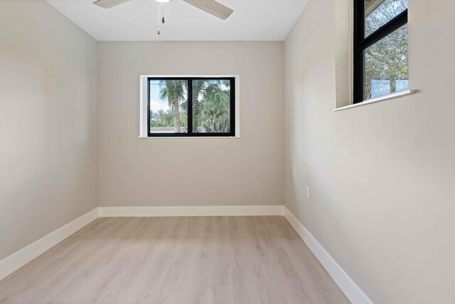 spare room with light hardwood / wood-style flooring and ceiling fan