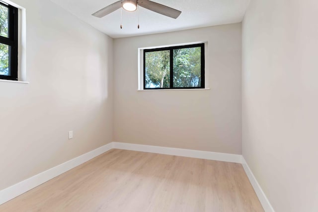 spare room featuring ceiling fan and light hardwood / wood-style floors