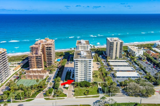 birds eye view of property featuring a water view and a view of the beach