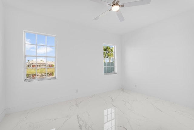 spare room with ceiling fan